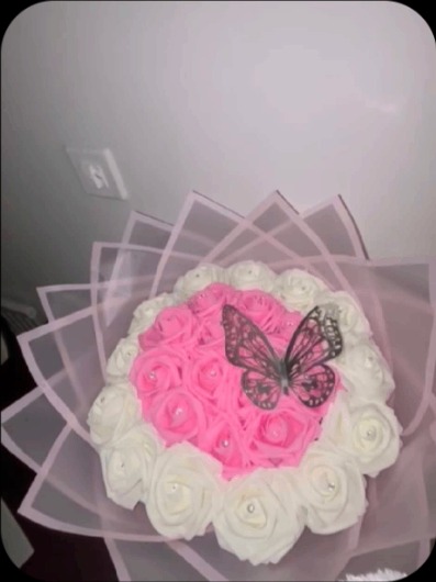 Pink and white rose bouquet with butterfly