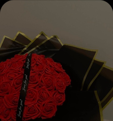 Red roses in black and gold wrap