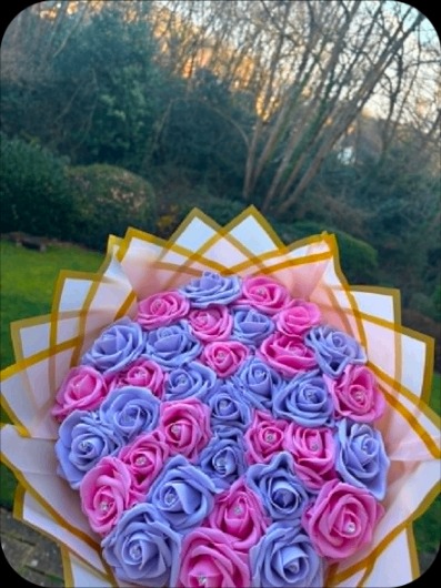 Pink and lilac rose bouquet outdoors