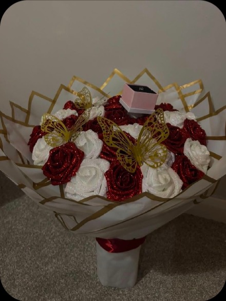 Red and white roses with gold butterflies and ring box