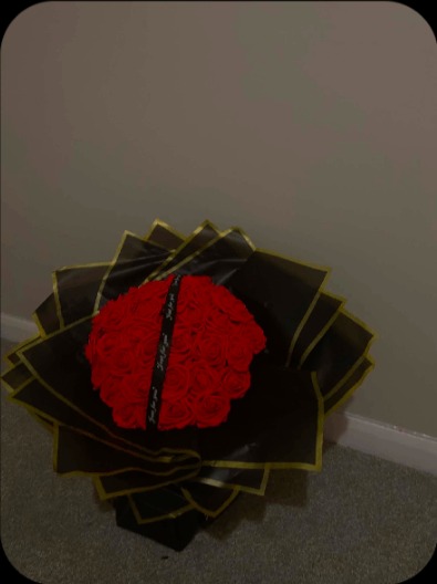 Red rose bouquet in black gold-trim wrap